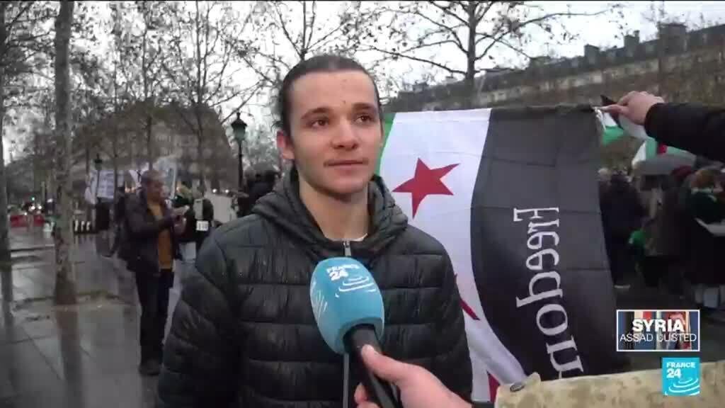 Parisians gather to celebrate the fall of the Assad regime in Syria