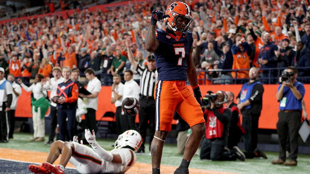 CFP Miami hopes to take a big hit after losing 21-0 to Syracuse; Clemson will play in the ACC title game